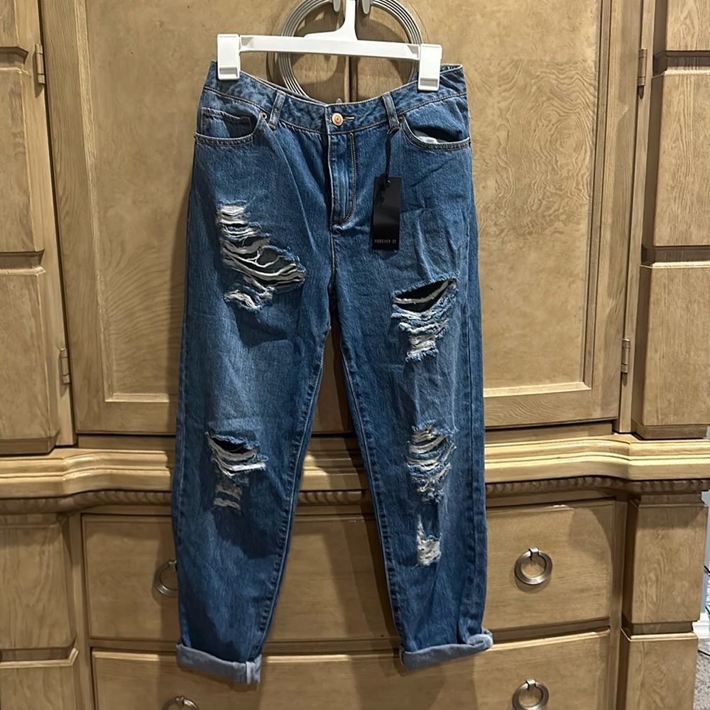 Forever 21 blue jeans, ripped legs size 28 new with tags.